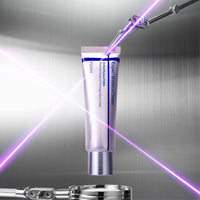 The tube lit by a violet beam against brushed steel