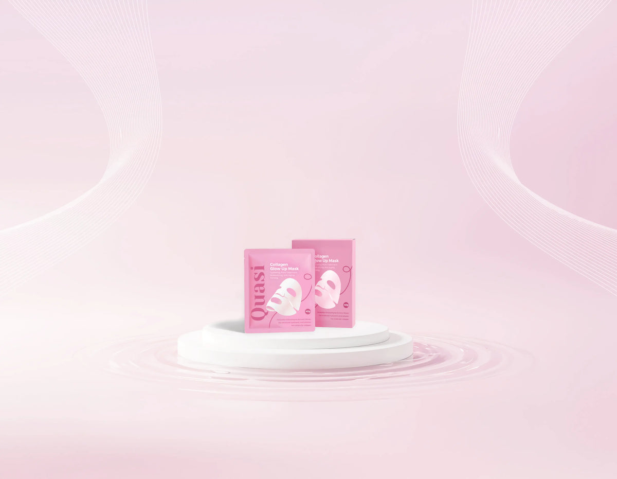 Two Quasi Collagen Glow Up Mask 2.0 boxes on a pale pink podium